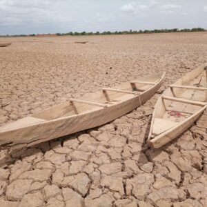 eSIM Burkina Faso with brown wooden boat on brown sand during daytime