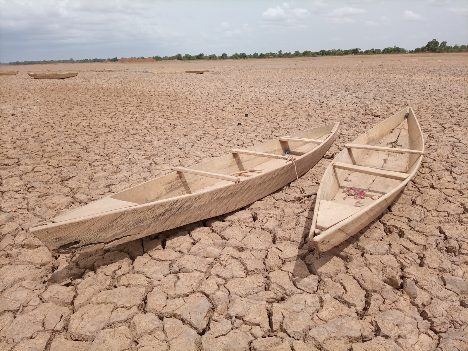 eSIM Burkina Faso with brown wooden boat on brown sand during daytime