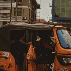 orange car with black umbrella on top