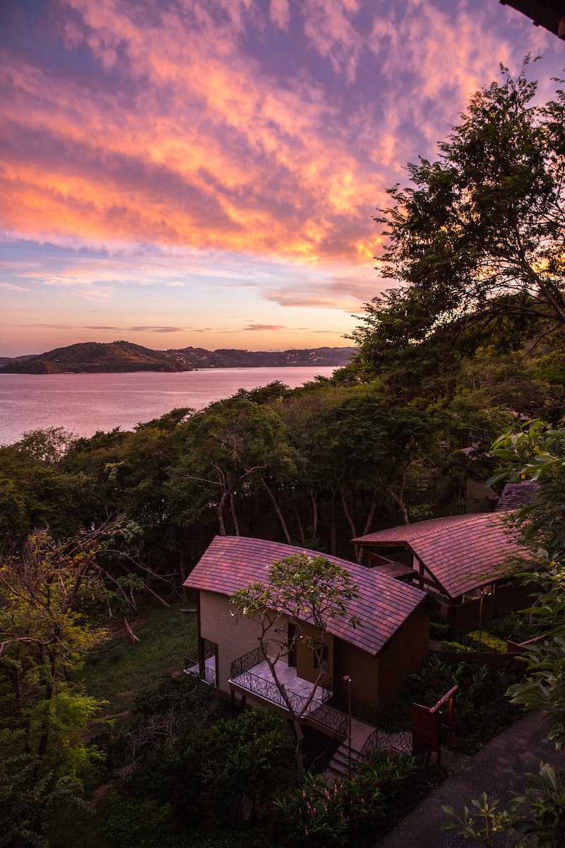 eSIM Costa Rica brown wooden house near trees