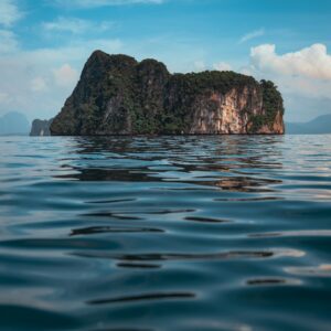 brown rock formation on blue sea water during daytime