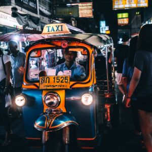 person riding on Taxi cub