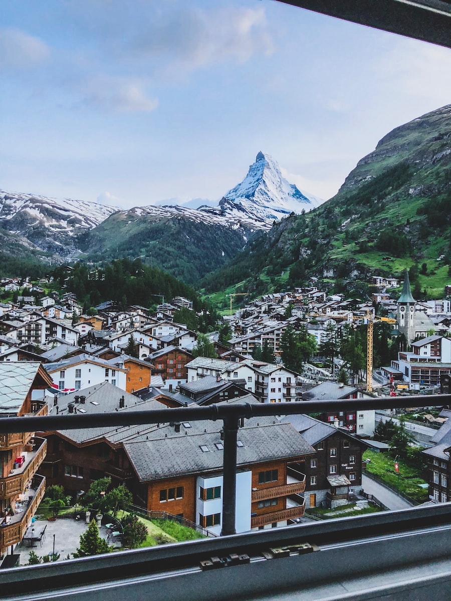 aerial photography of houses near mountains at daytime