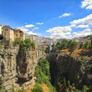 white concrete building on top of mountain during daytime